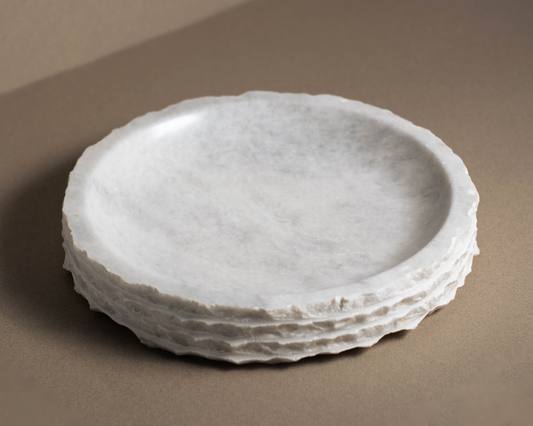 Top view of the Eclipse White Marble Bowl showcasing natural white marble veining and an organic sculptural form.