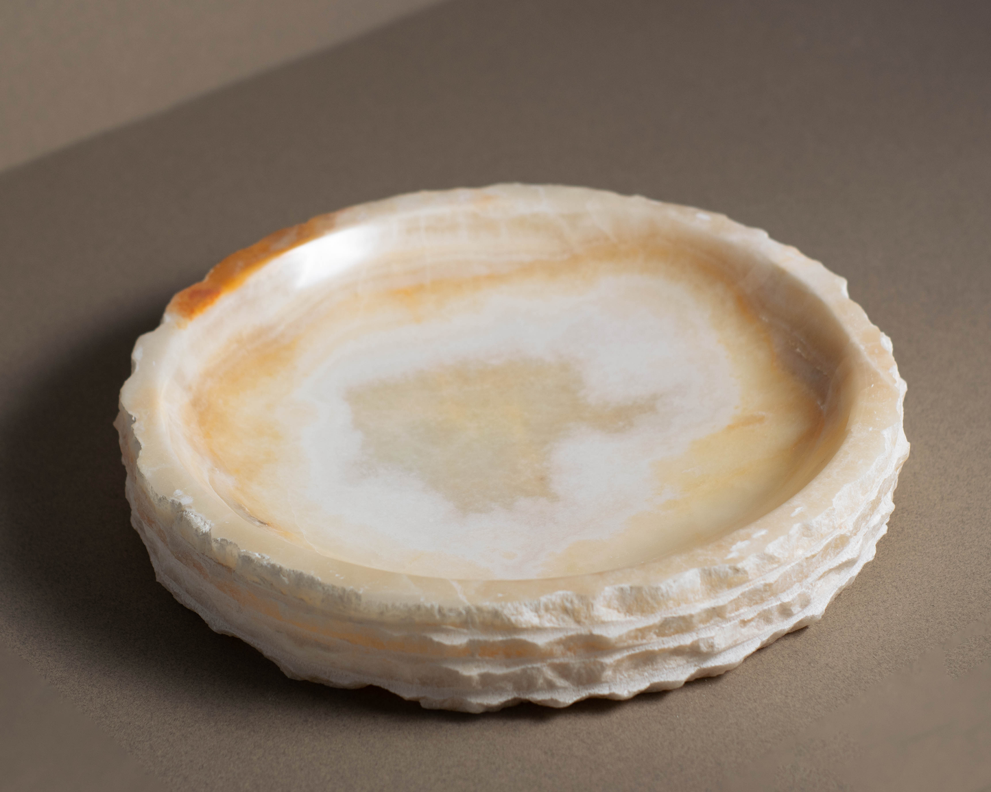 Top view of the Eclipse White Onyx Bowl highlighting natural white onyx patterns and polished finish.