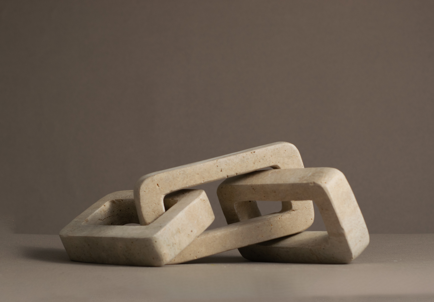 Eternal Travertine Chain Link handcrafted from a single solid piece of natural travertine.