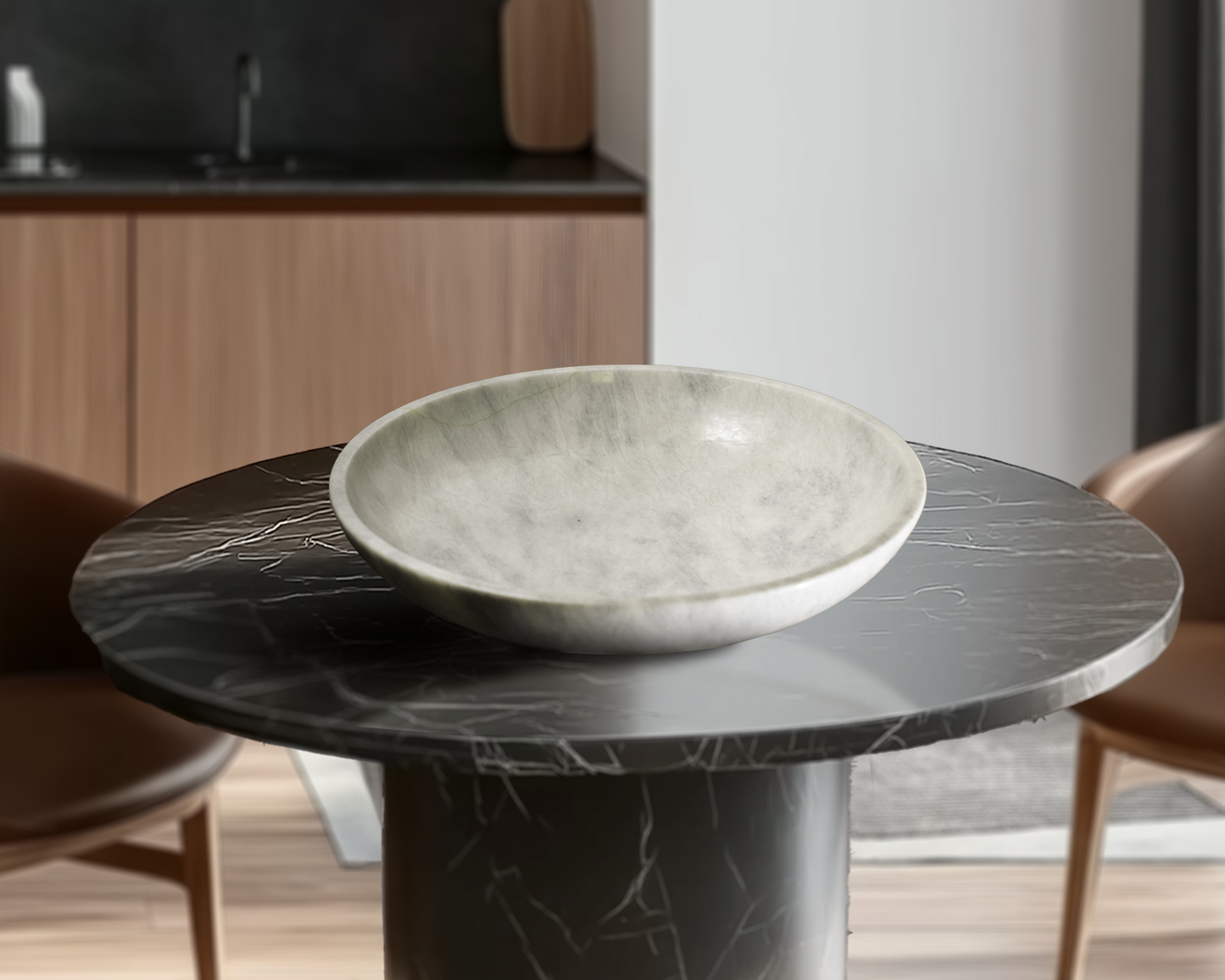 Grande White Marble Decorative Bowl styled as a luxury centerpiece on a black marble table in a contemporary living space.