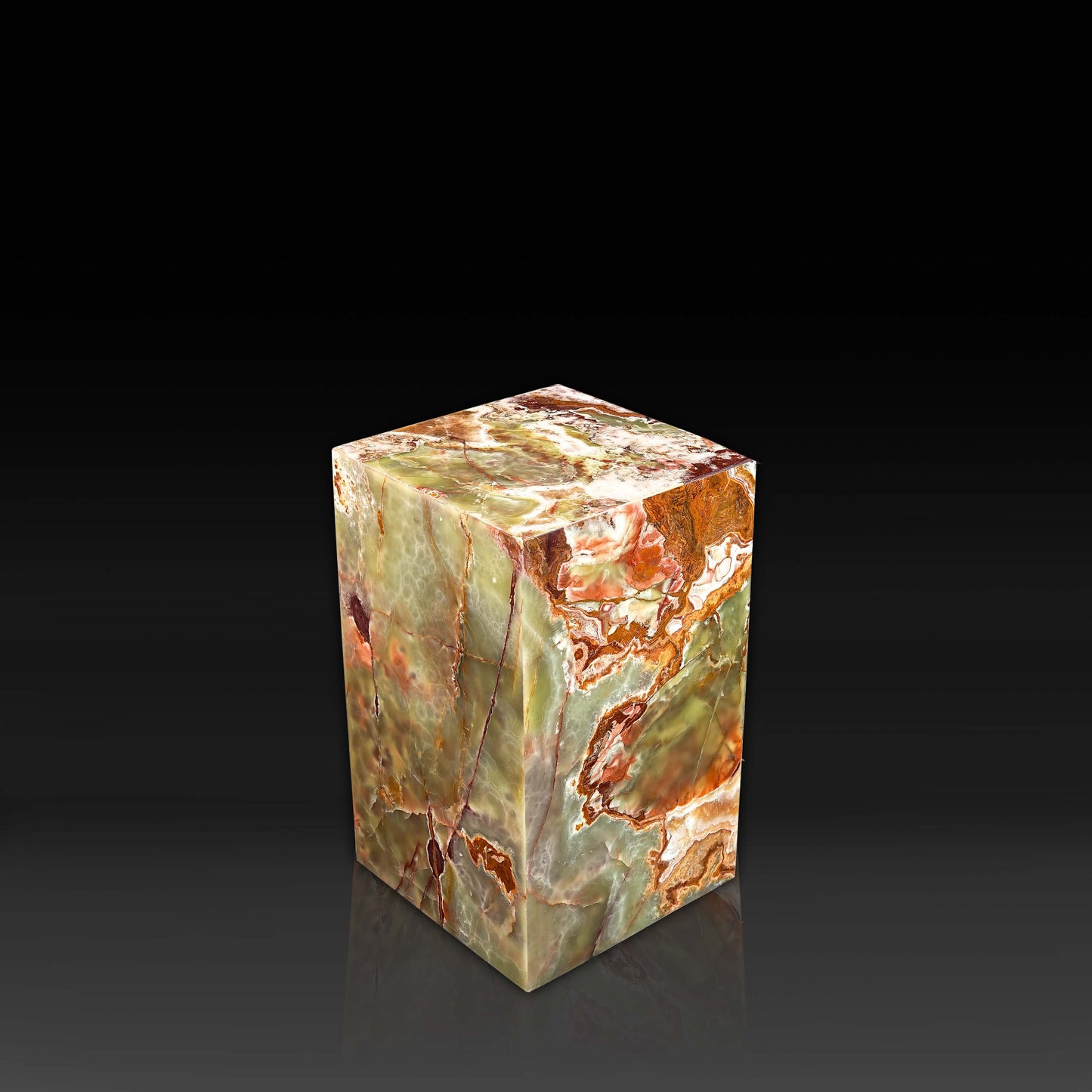Side angle view of handcrafted Green Onyx column side table highlighting natural translucent onyx patterns.