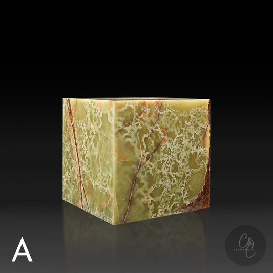 Green onyx cube side table variation A shown from the front profile, highlighting its rich natural veining.