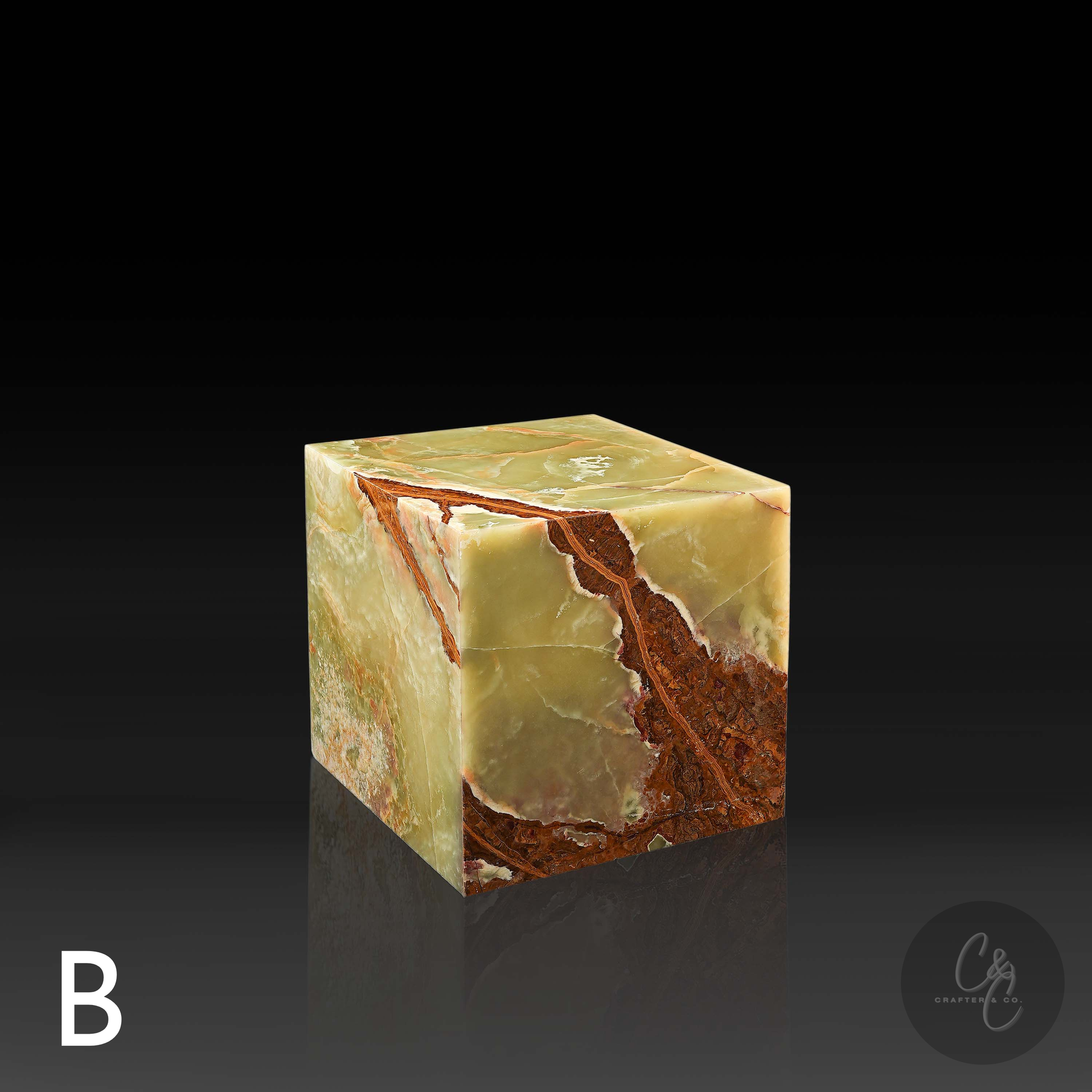 Green onyx cube side table variation B shown from the front profile, highlighting its bold rust and amber veining.
