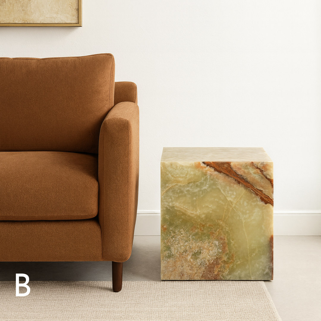 Green onyx cube side table variation B styled beside a brown sofa in a refined living room.