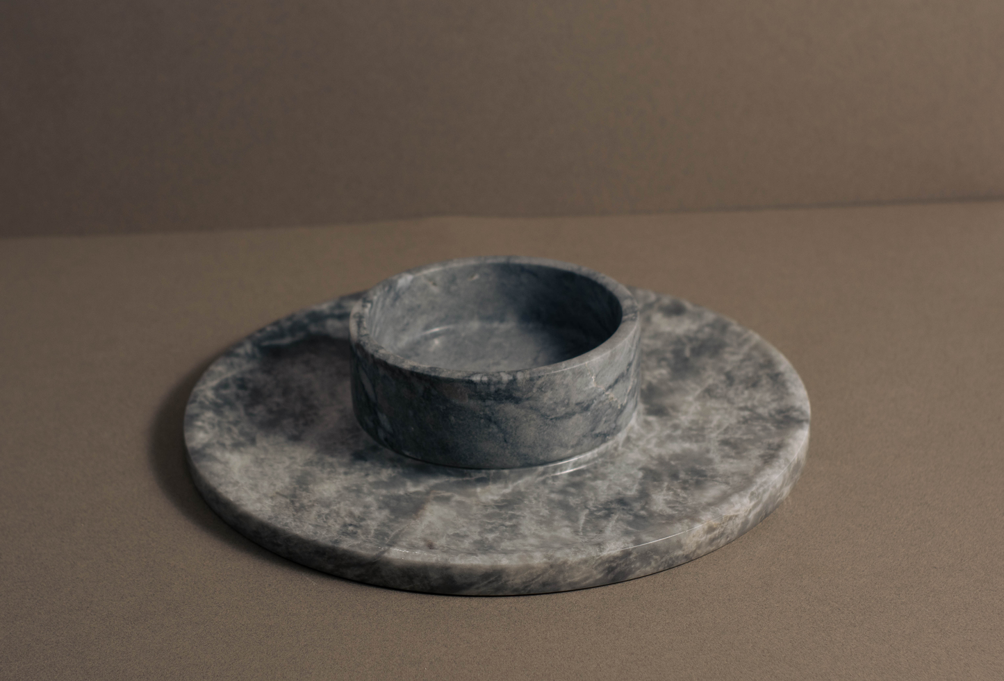 Grey Marble Round Cheese Platter with integrated marble bowl.