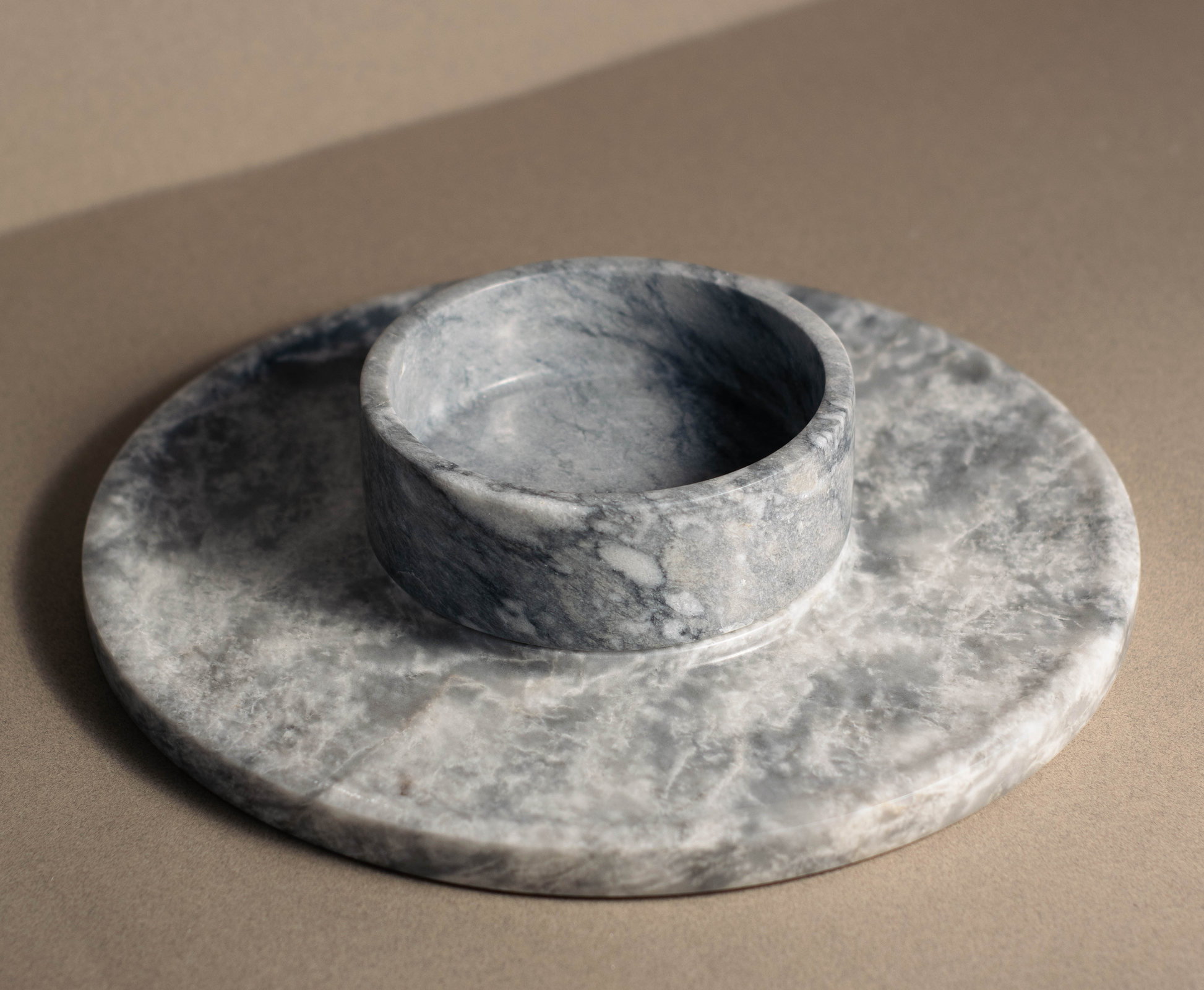 Top view of Grey Marble Round Cheese Platter with integrated bowl.
