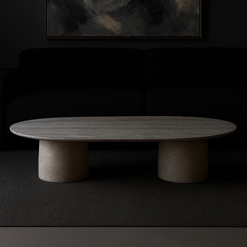 Harmony Travertine Coffee Table in a modern living room featuring an oval natural travertine tabletop with sculptural cylindrical bases.