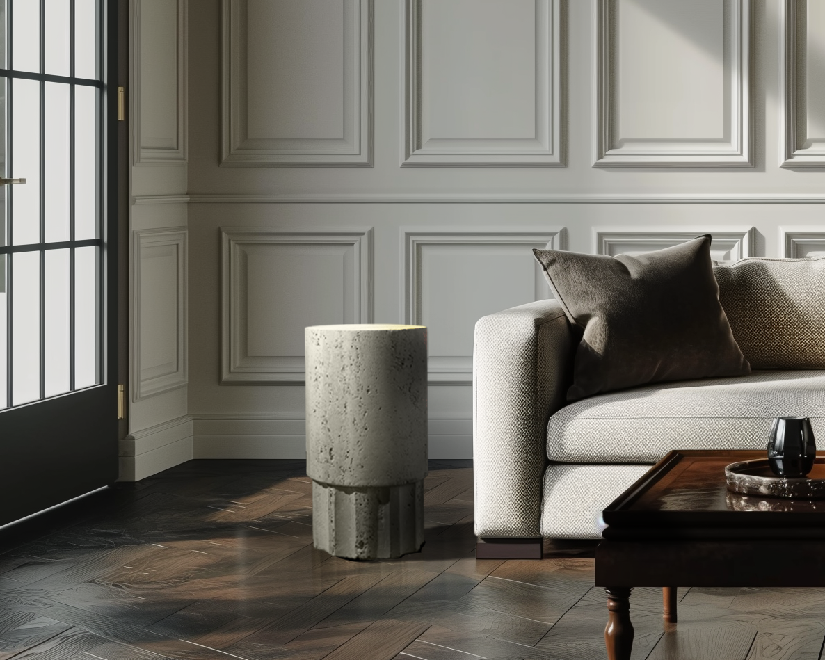 Heritage Travertine Side Table styled beside a sofa in a contemporary living room with warm natural stone finishes.