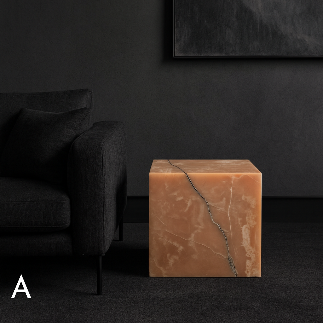 Honey Onyx cube side table with natural amber tones and bold black veining in a contemporary living room