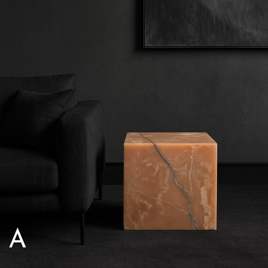 Honey Onyx cube side table with natural amber tones and bold black veining in a contemporary living room