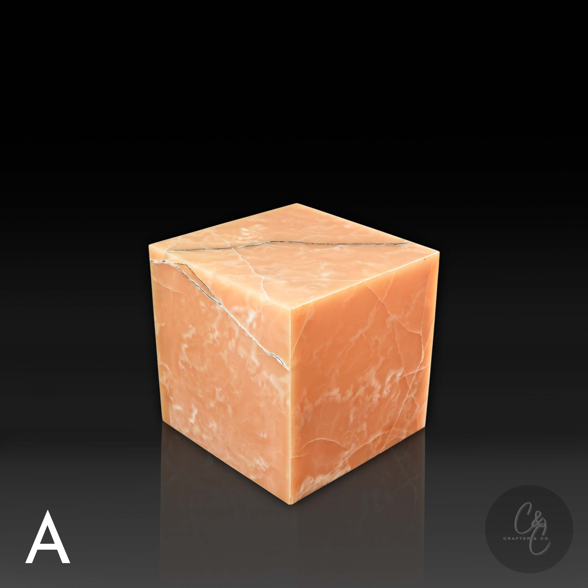 Honey Onyx cube side table viewed from the top angle, highlighting natural amber tones and distinctive black veining