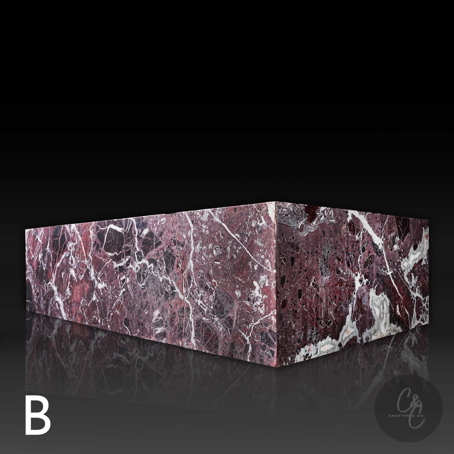 Angled view of Large Block Coffee Table in Rosso Levanto Marble (Variant B) showcasing rich burgundy marble with bold white veining and a honed finish.
