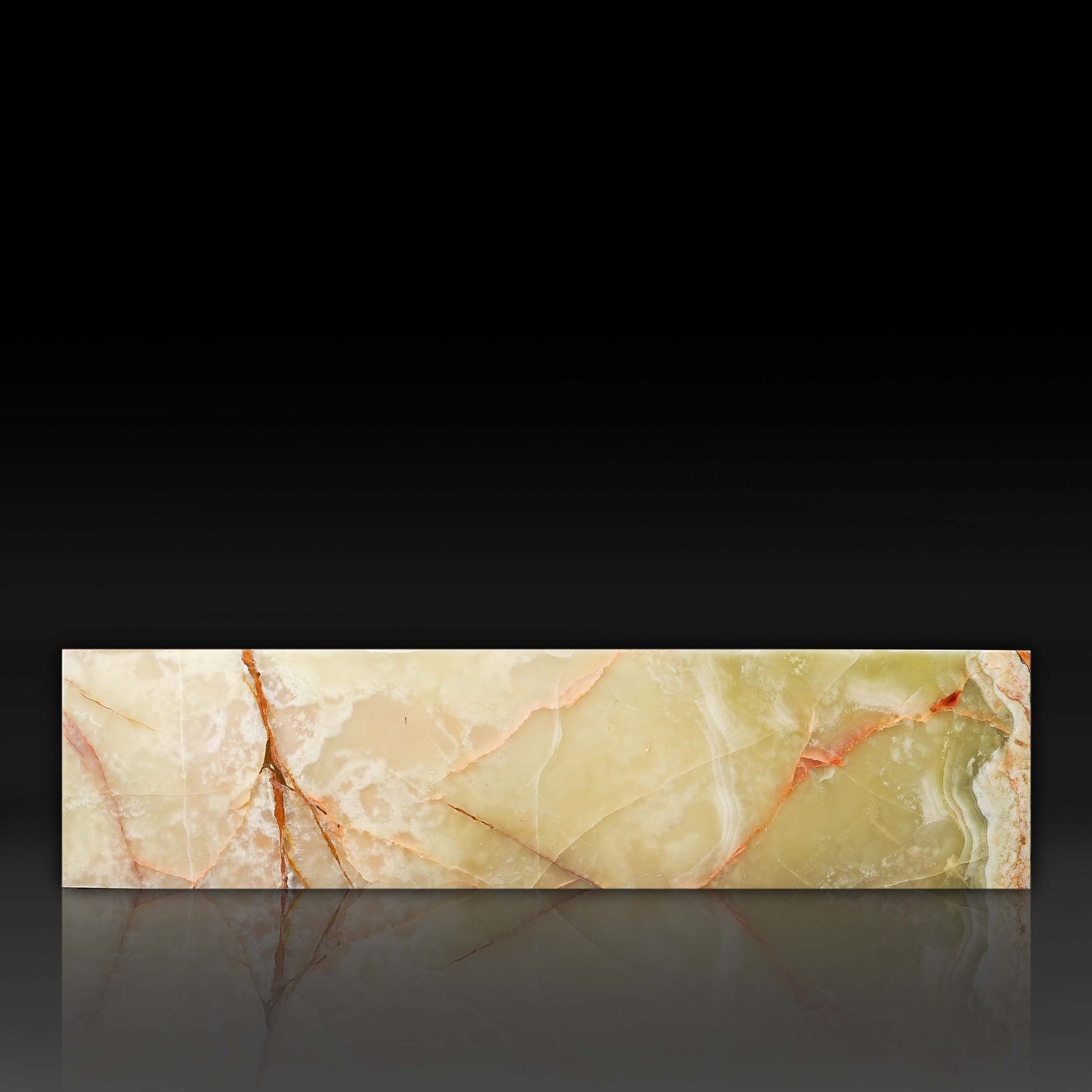 Front profile of the Large Block Green Onyx Coffee Table highlighting natural onyx veining and polished finish