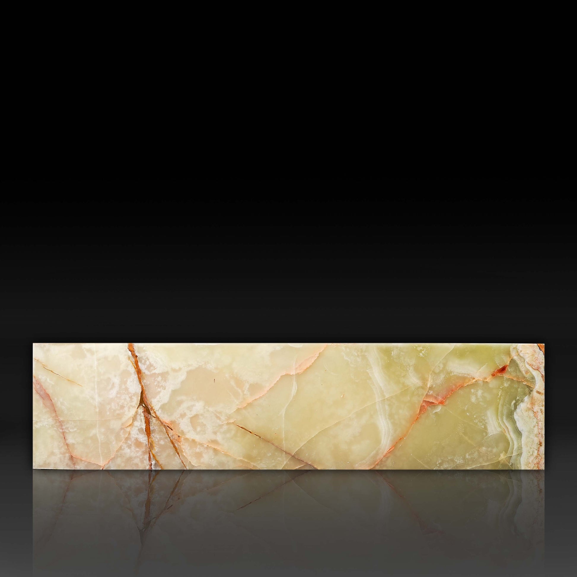 Front profile of the Large Block Green Onyx Coffee Table highlighting natural onyx veining and polished finish