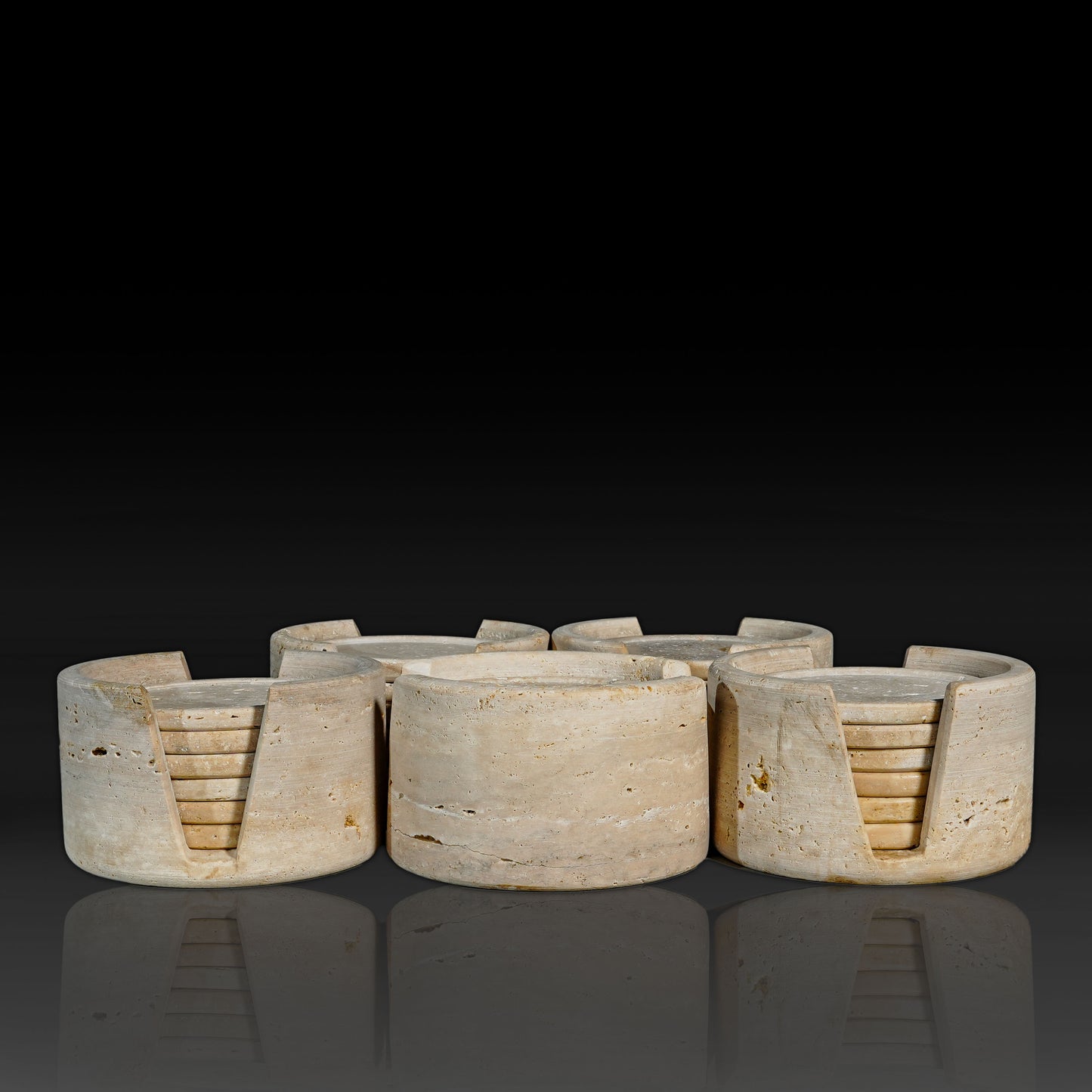 Group of Murmor Travertine natural stone coasters sets with matching holders.