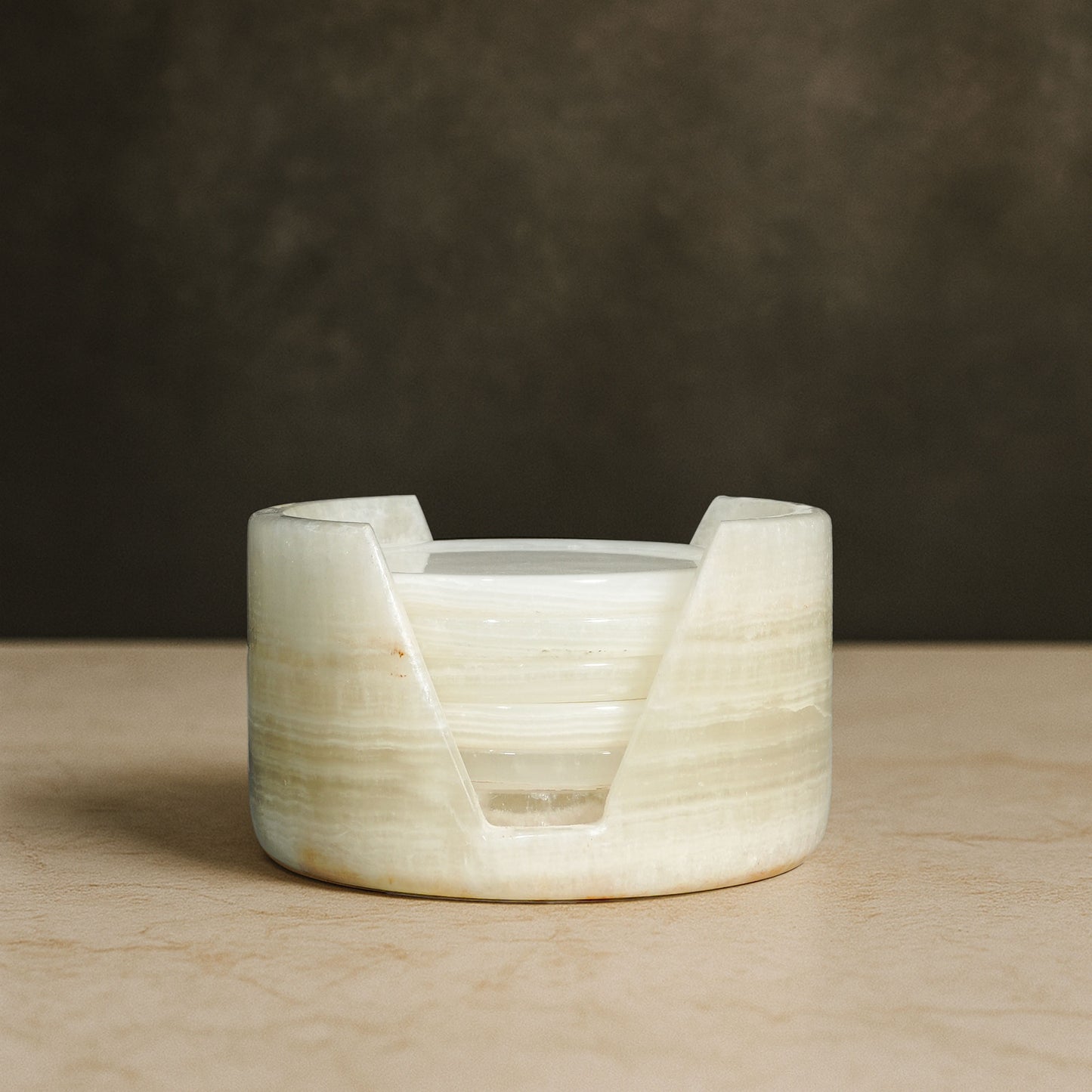 Murmor natural stone coasters set with holder in White Onyx featuring polished stone and subtle veining.
