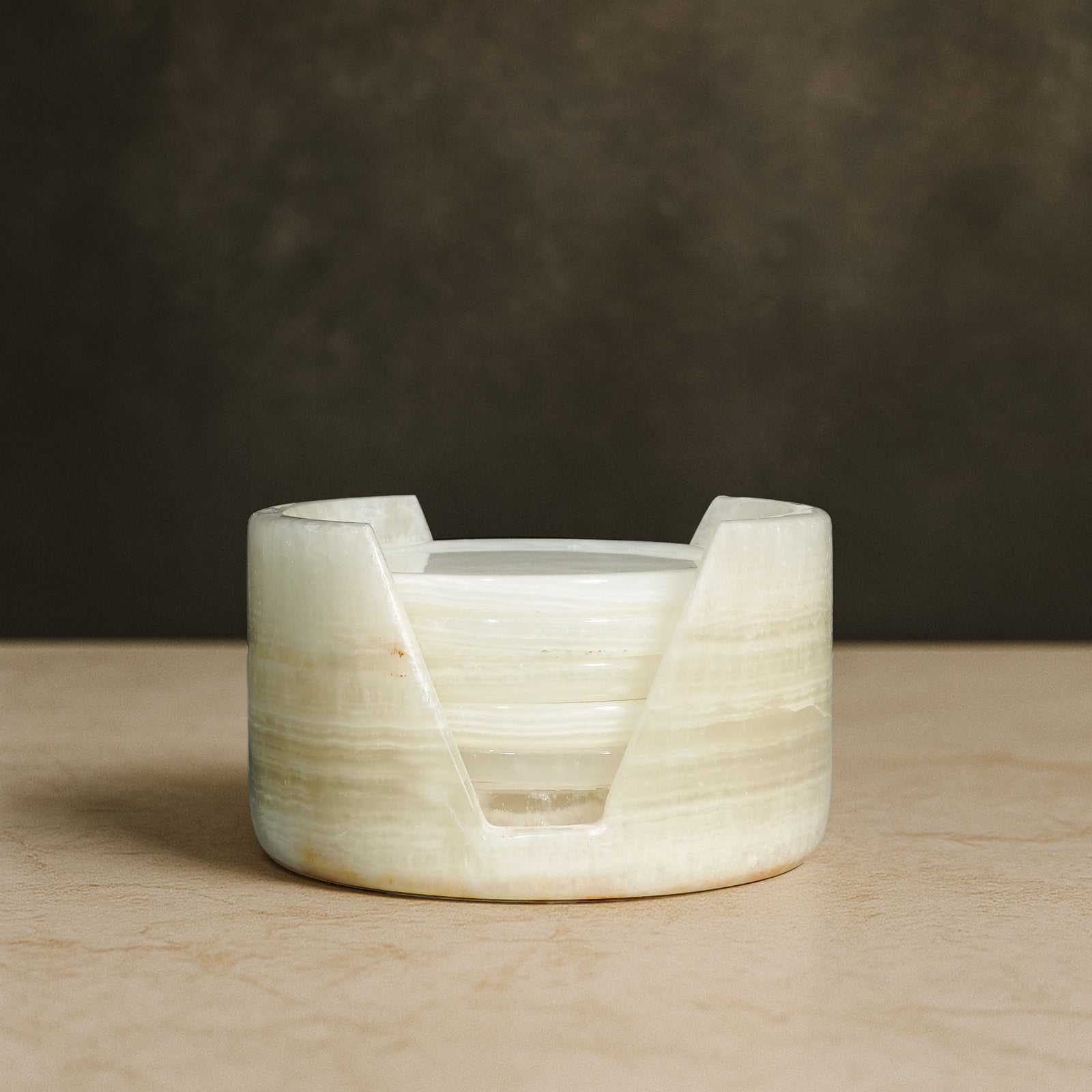 Murmor natural stone coasters set with holder in White Onyx featuring polished stone and subtle veining.