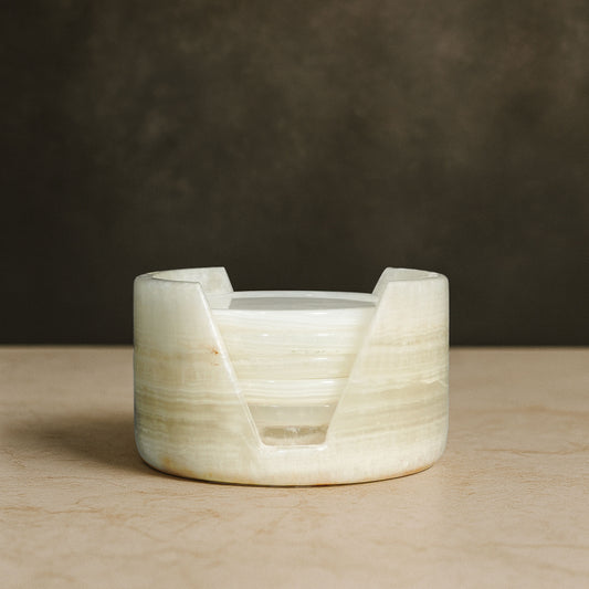 Murmor natural stone coasters set with holder in White Onyx featuring polished stone and subtle veining.