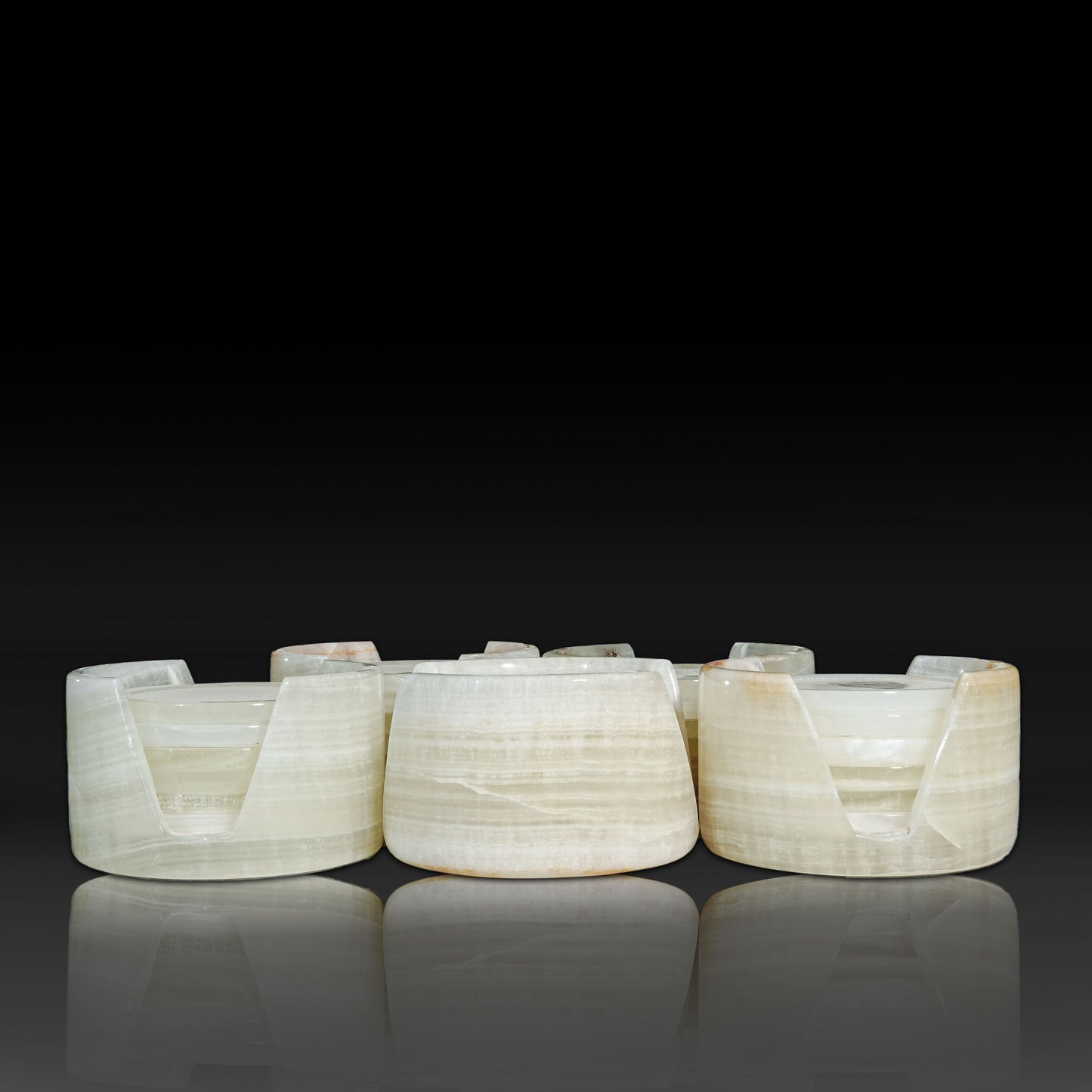 Group of Murmor White Onyx natural stone coasters sets with matching holders.