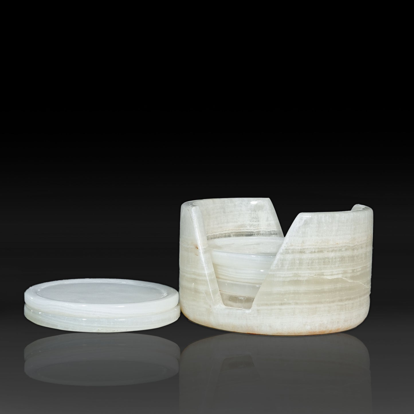 Murmor natural stone coasters set with holder in White Onyx displaying stacked round coasters.