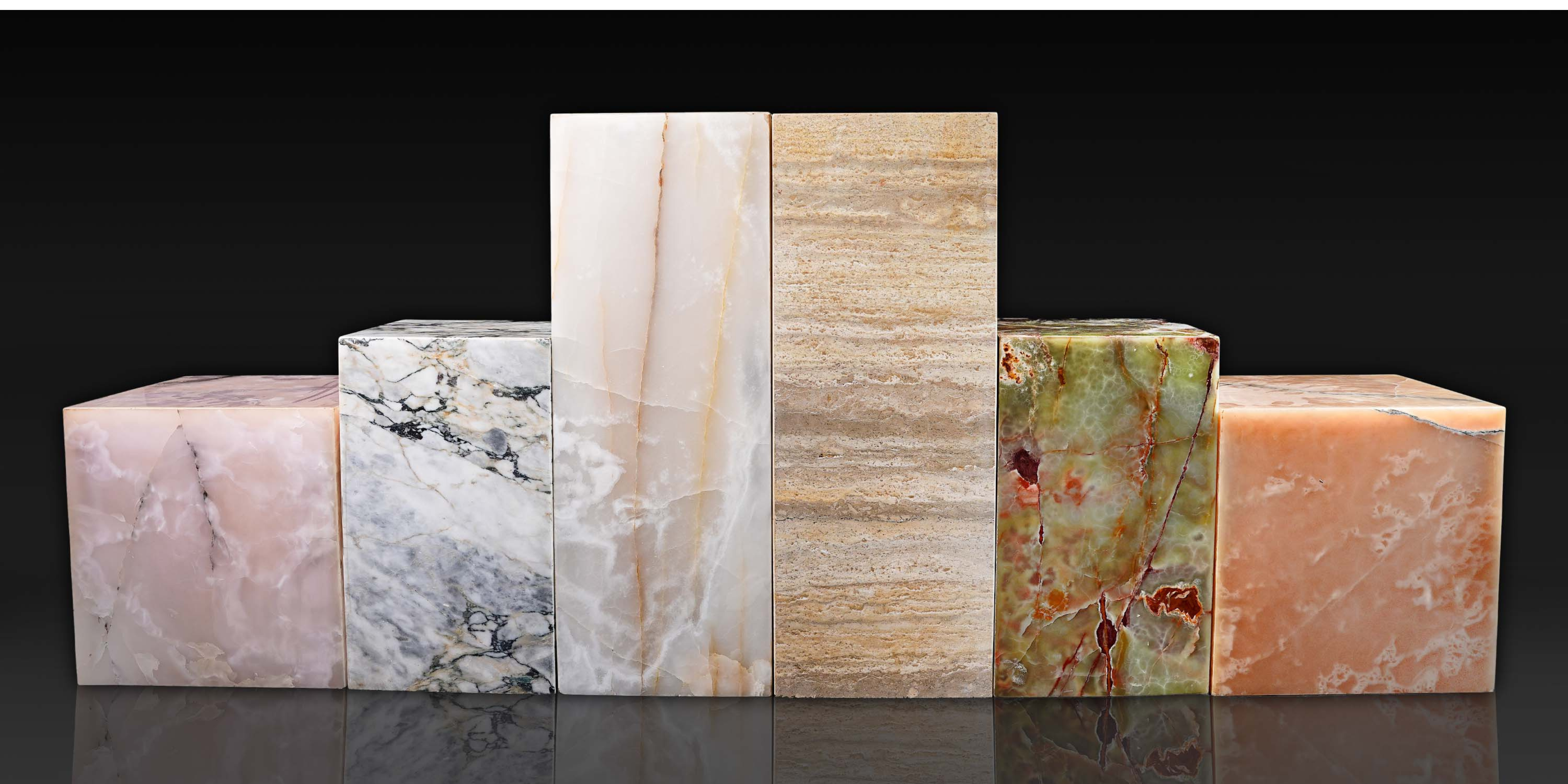 Natural stone plinth collection featuring pink onyx, Arabescato Viola marble, white onyx, travertine, green onyx and honey onyx.
