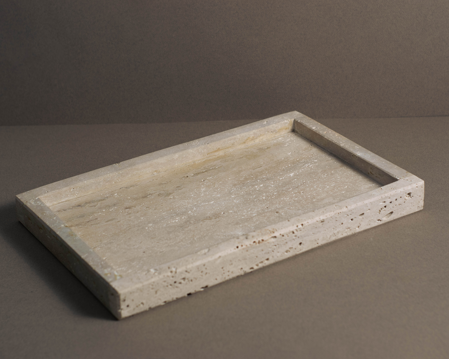 Oblong Travertine Tray handcrafted from natural travertine with a clean architectural design.