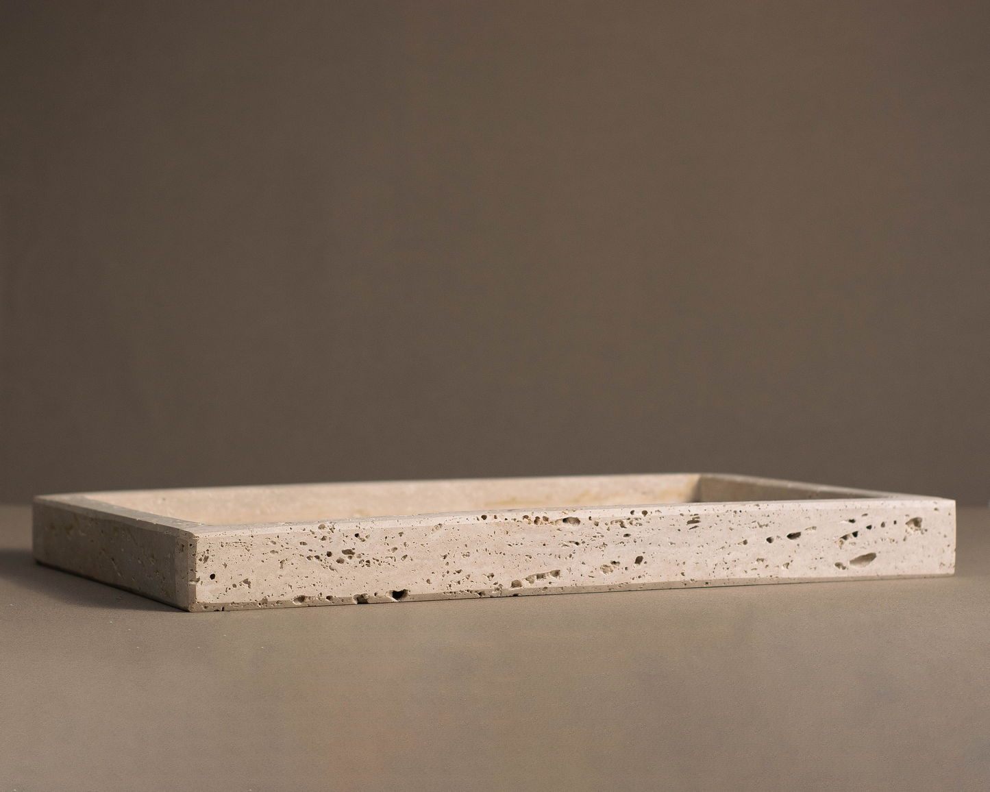 Side profile of the Oblong Travertine Tray with the Thick edge option.