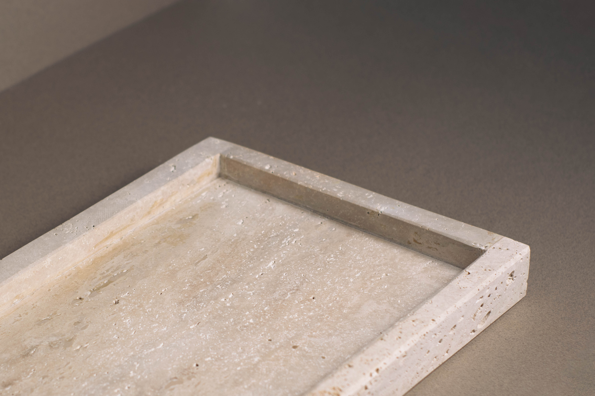 Side profile of the Oblong Travertine Tray with the Thick edge option