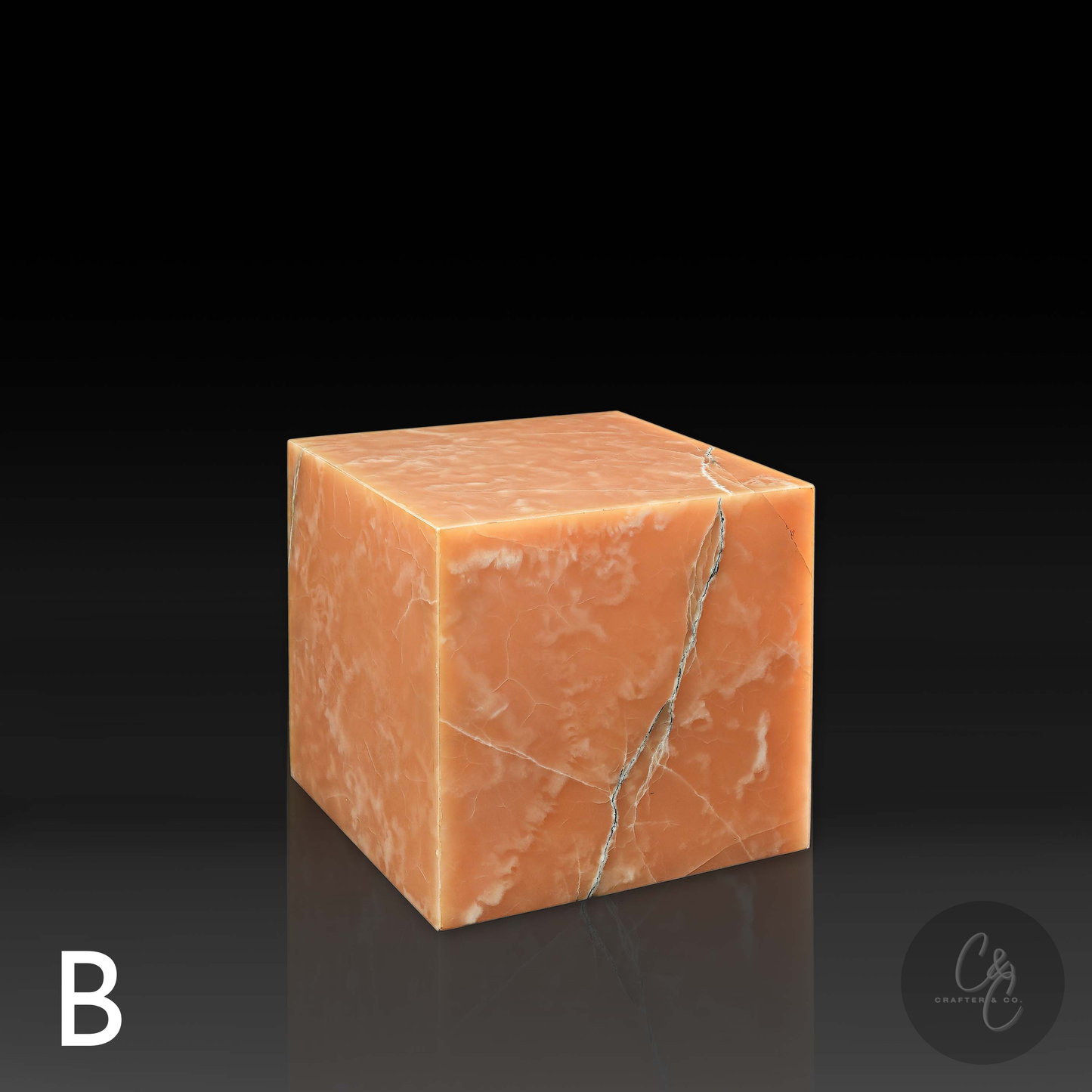 Orange onyx cube side table variation B with distinctive natural veining, shown from the front profile.