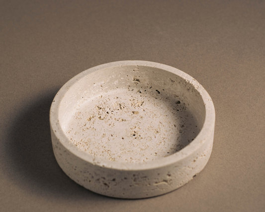 Orb Travertine Round Bowl handcrafted from natural travertine with warm earthy tones and a smooth circular design.