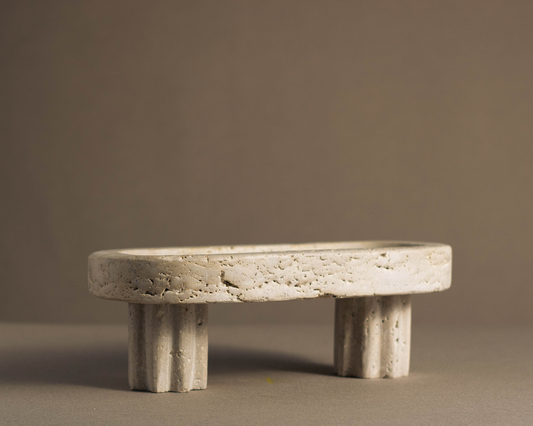 Oval Travertine Column Tray handcrafted from natural travertine with sculptural column base front view.