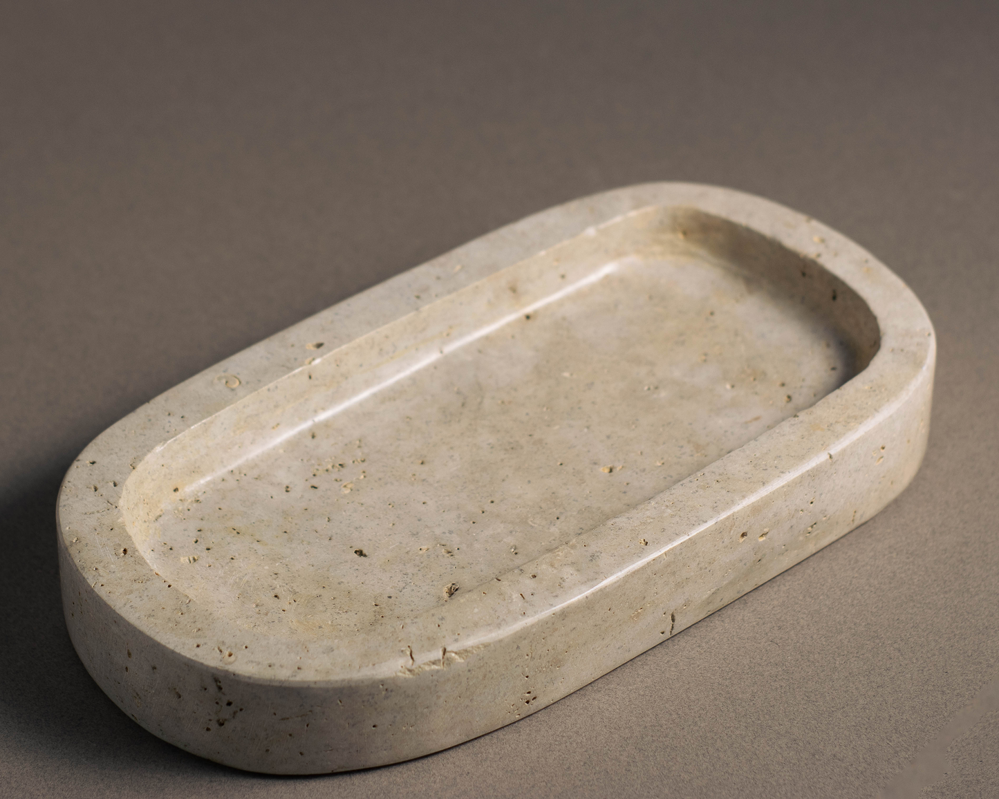 Oval Travertine Tray handcrafted from natural travertine for luxury home décor.