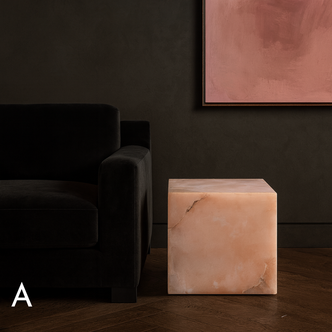 Pink onyx cube side table variation A styled beside a black armchair in a dark contemporary living room.