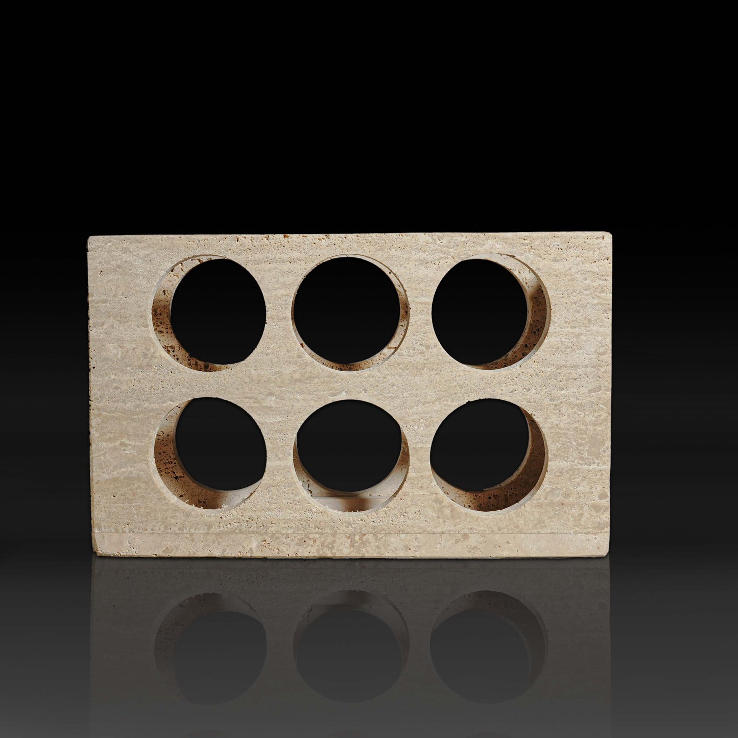 Quadrant Travertine Wine Rack front view handcrafted natural stone 6 bottle wine rack on black background.