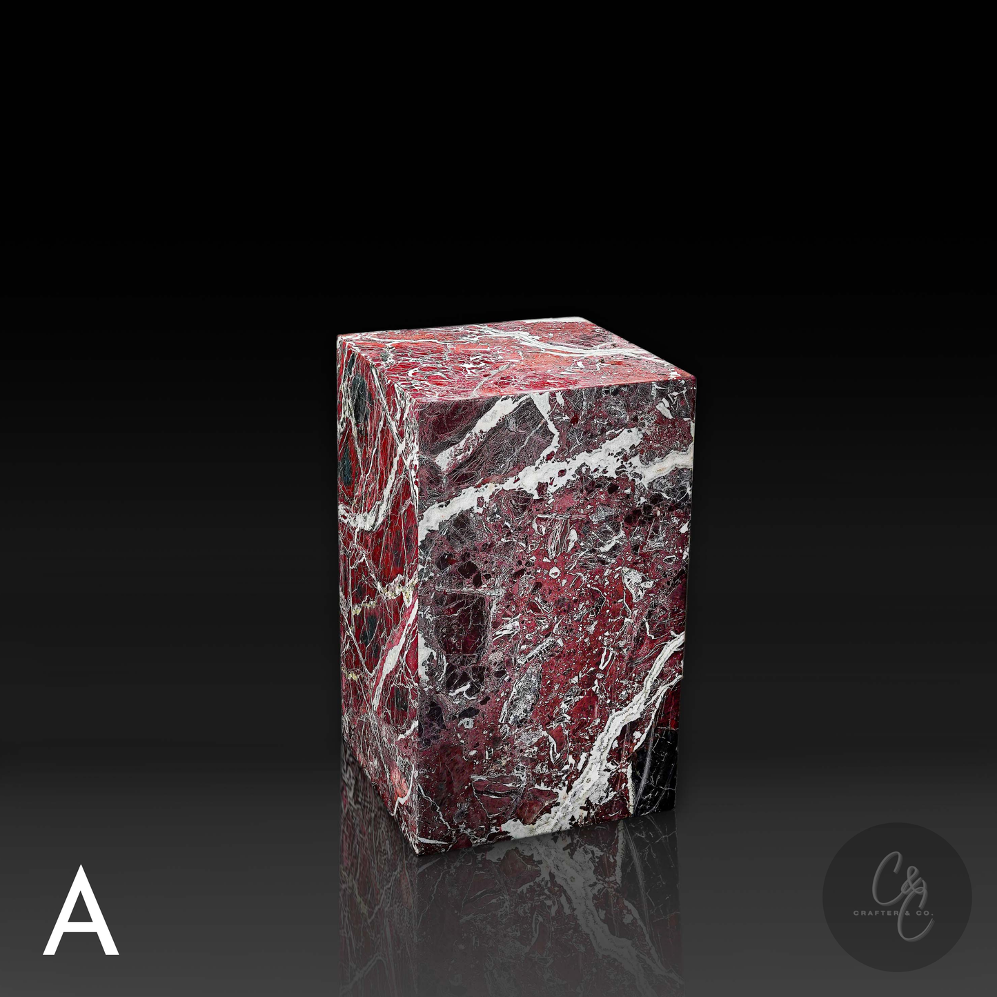 Angled view of handcrafted Rosso Levanto marble side table with striking burgundy marble and contrasting white veins.