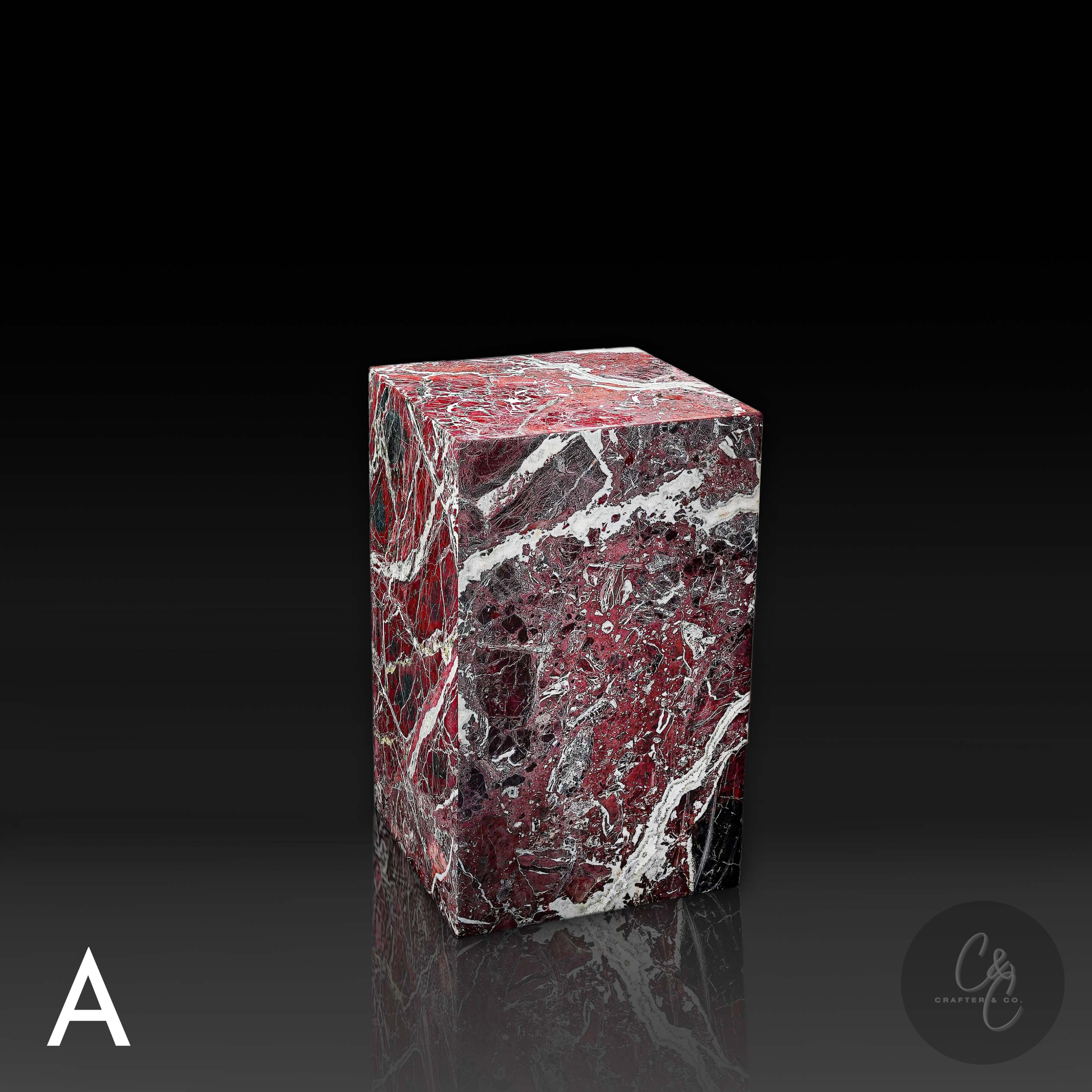 Angled view of handcrafted Rosso Levanto marble side table with striking burgundy marble and contrasting white veins.