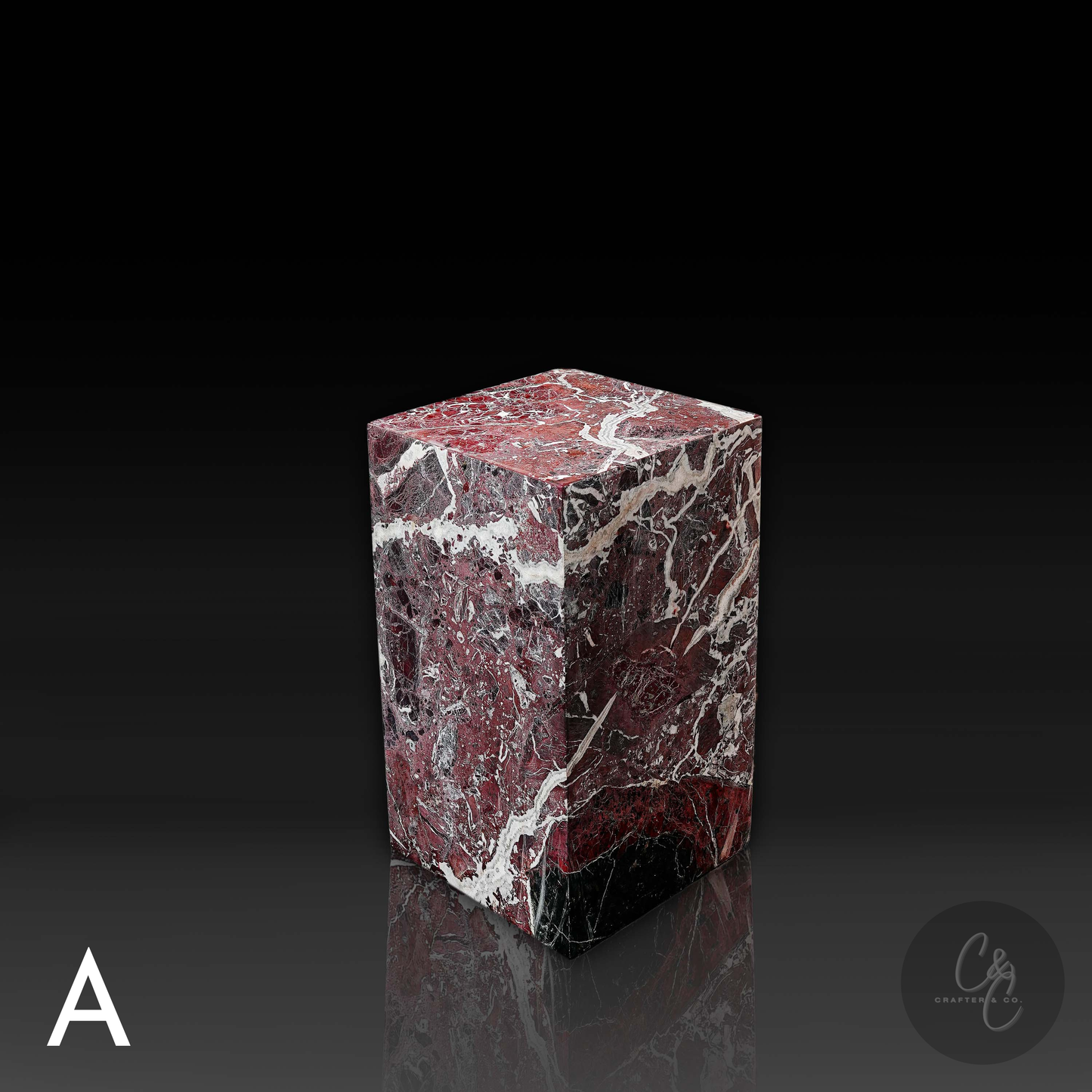 Top angled view of Rosso Levanto marble column side table highlighting natural stone patterns and premium craftsmanship.