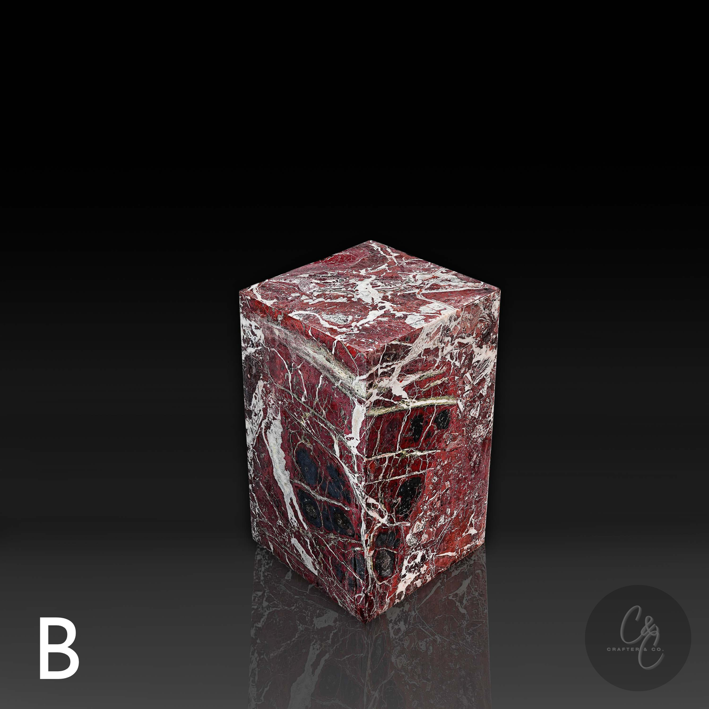 Top angled view of Rosso Levanto marble column side table featuring distinctive natural veining and sculptural form.