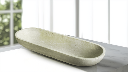 Luxury oval travertine decorative bowl styled on a modern console table.