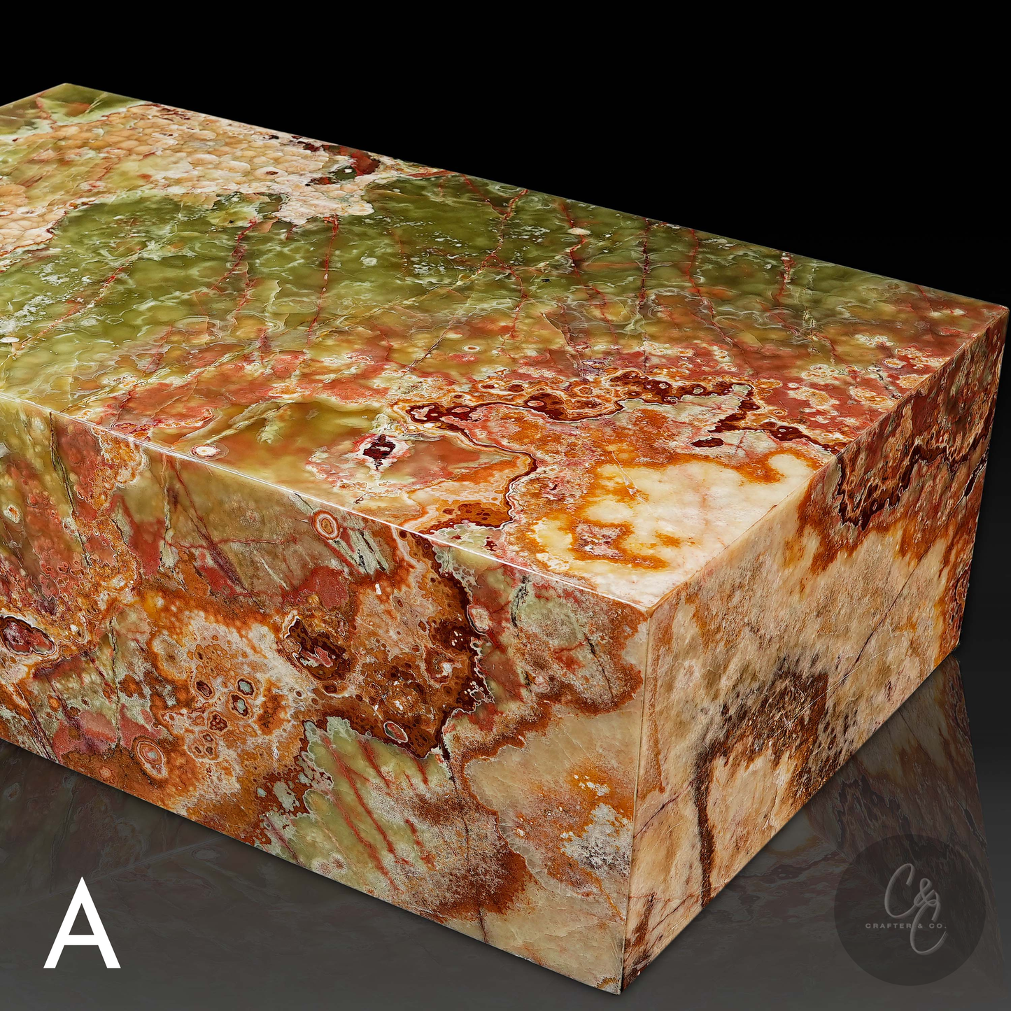 Angled view of Small Block Green Onyx Coffee Table A handcrafted polished natural green onyx coffee table featuring dramatic green rust cream and amber veining.