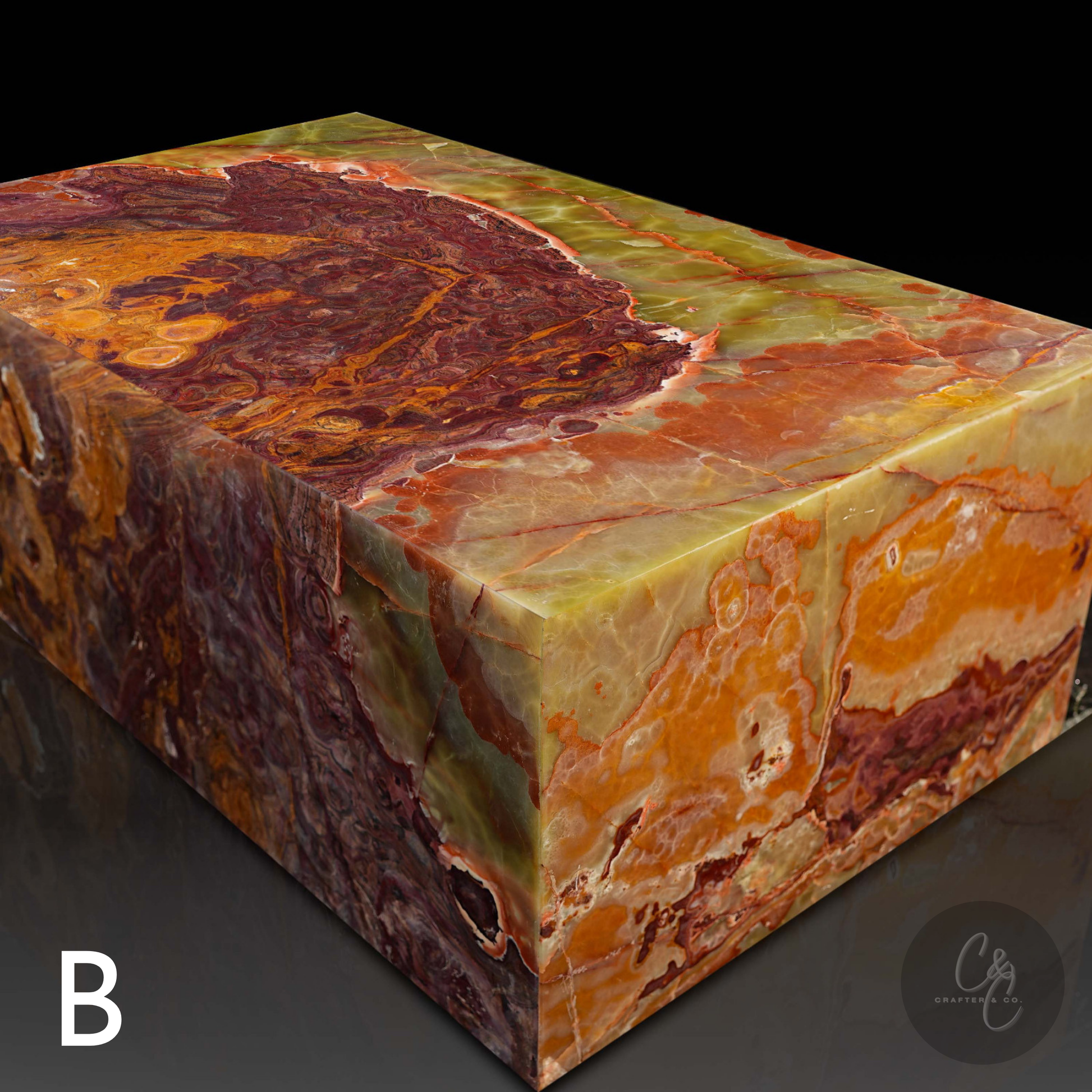 Angled view of Small Block Green Onyx Coffee Table B handcrafted from polished natural green onyx with bold green rust amber and cream veining