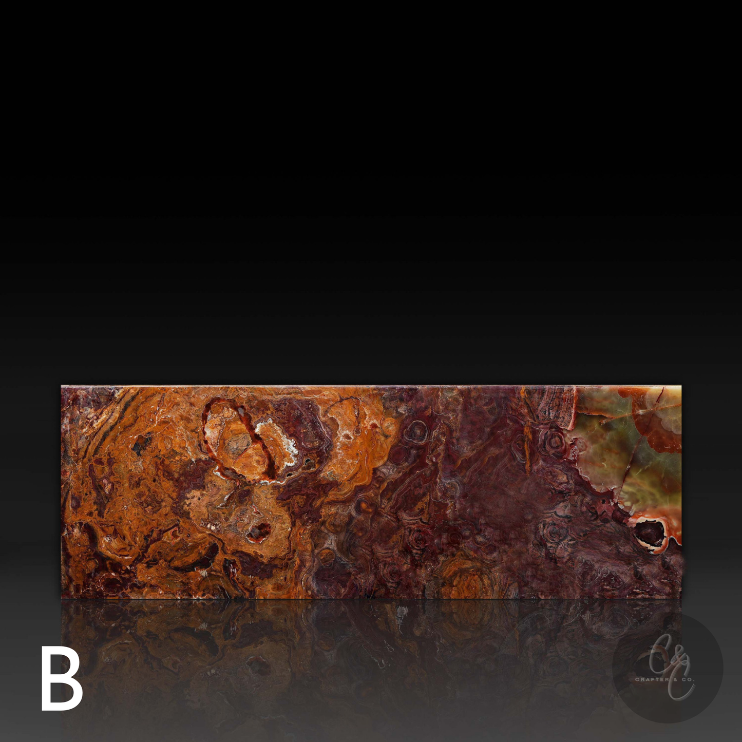 Front view of Small Block Green Onyx Coffee Table B featuring polished natural green onyx with dramatic burgundy, amber and olive green veining