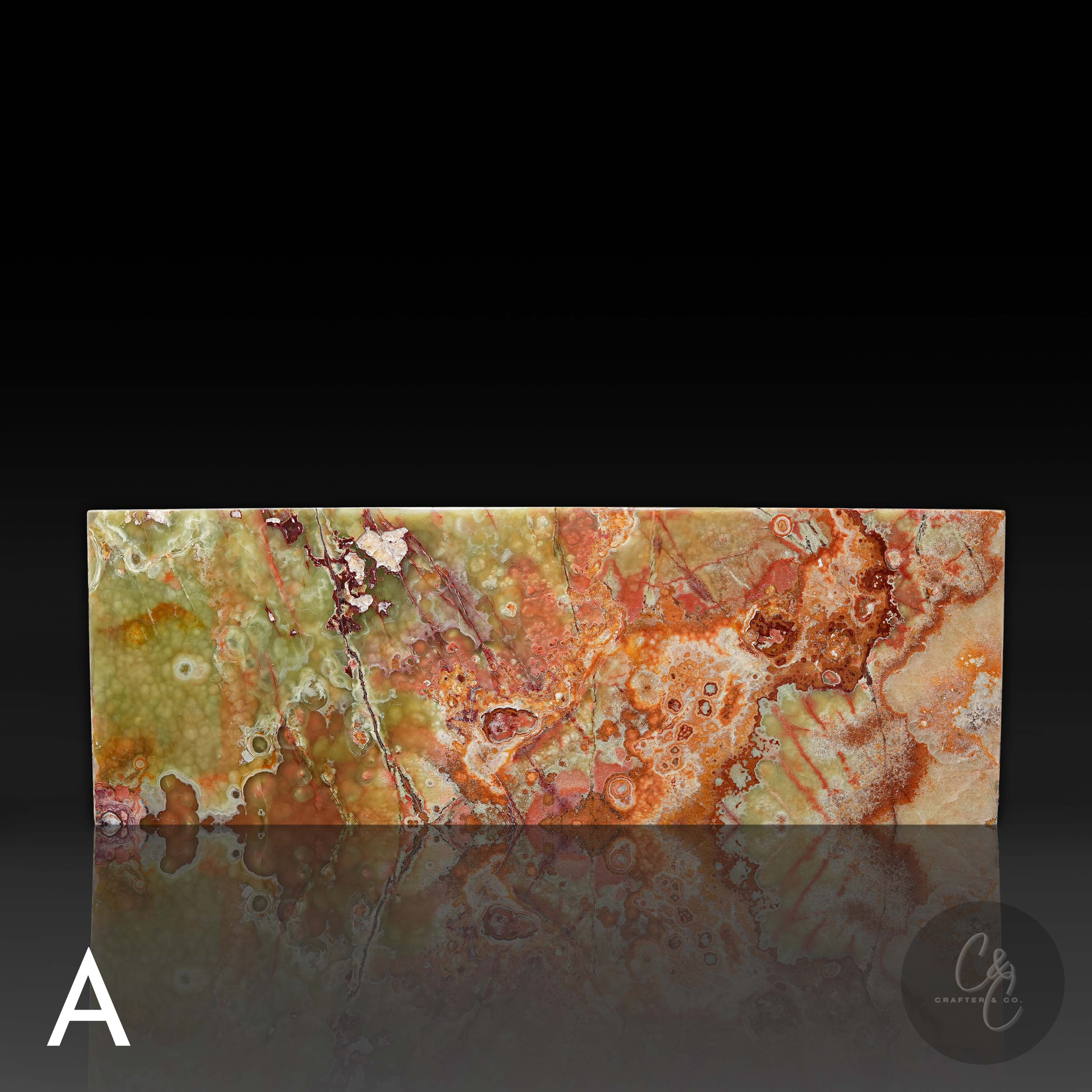 Front profile view of Small Block Green Onyx Coffee Table A showcasing polished natural green onyx with dramatic green rust amber and cream veining.