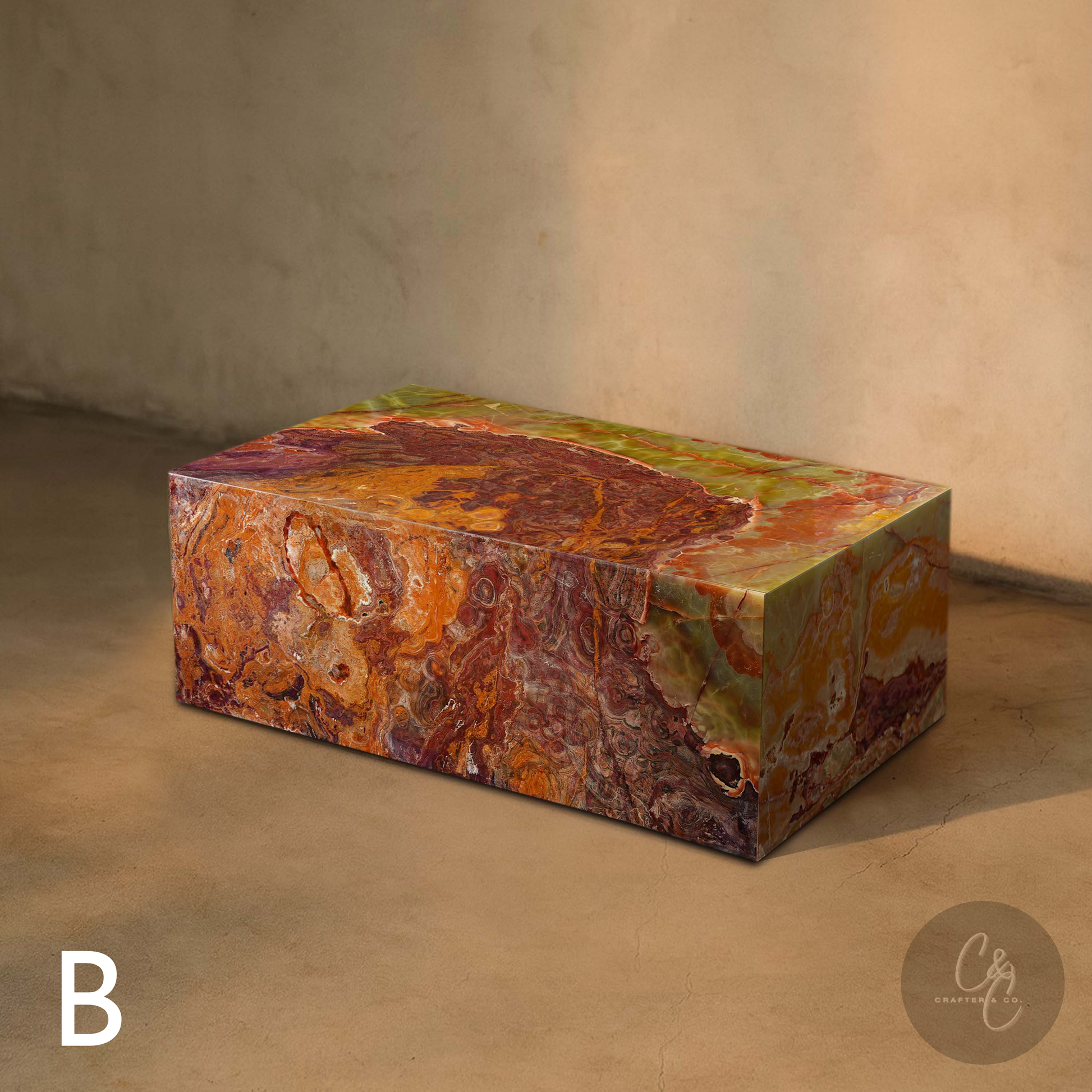 Lifestyle view of Small Block Green Onyx Coffee Table B handcrafted from polished natural green onyx with rich green rust amber and cream veining.