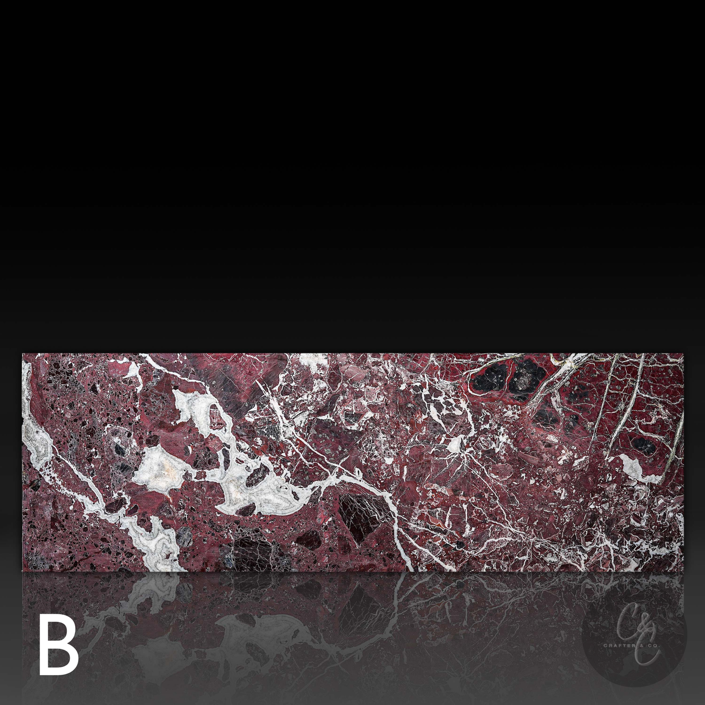 Back view of Small Block Rosso Levanto Marble Coffee Table Variant B highlighting rich burgundy marble with striking white veining and natural black accents.