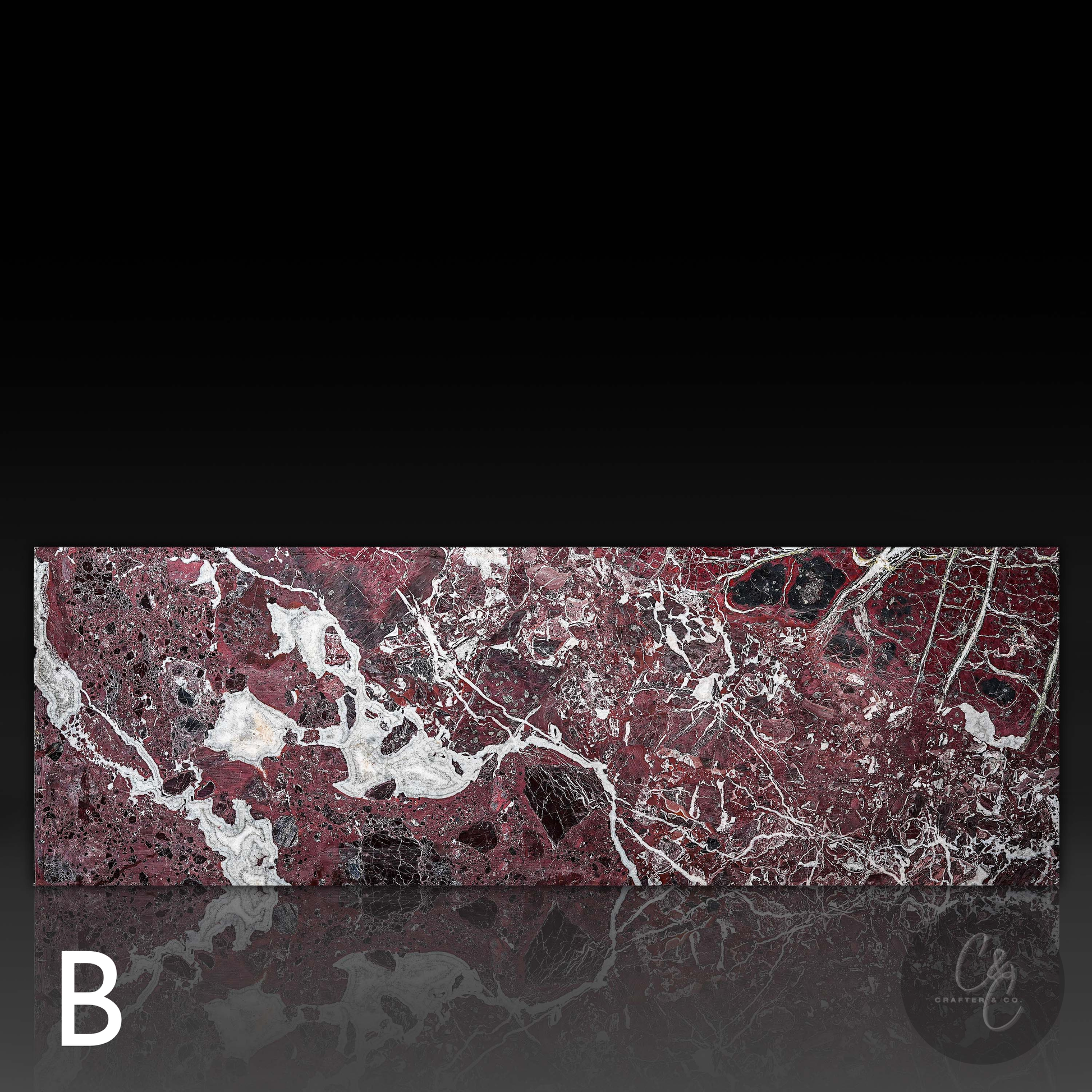 Back view of Small Block Rosso Levanto Marble Coffee Table Variant B highlighting rich burgundy marble with striking white veining and natural black accents.