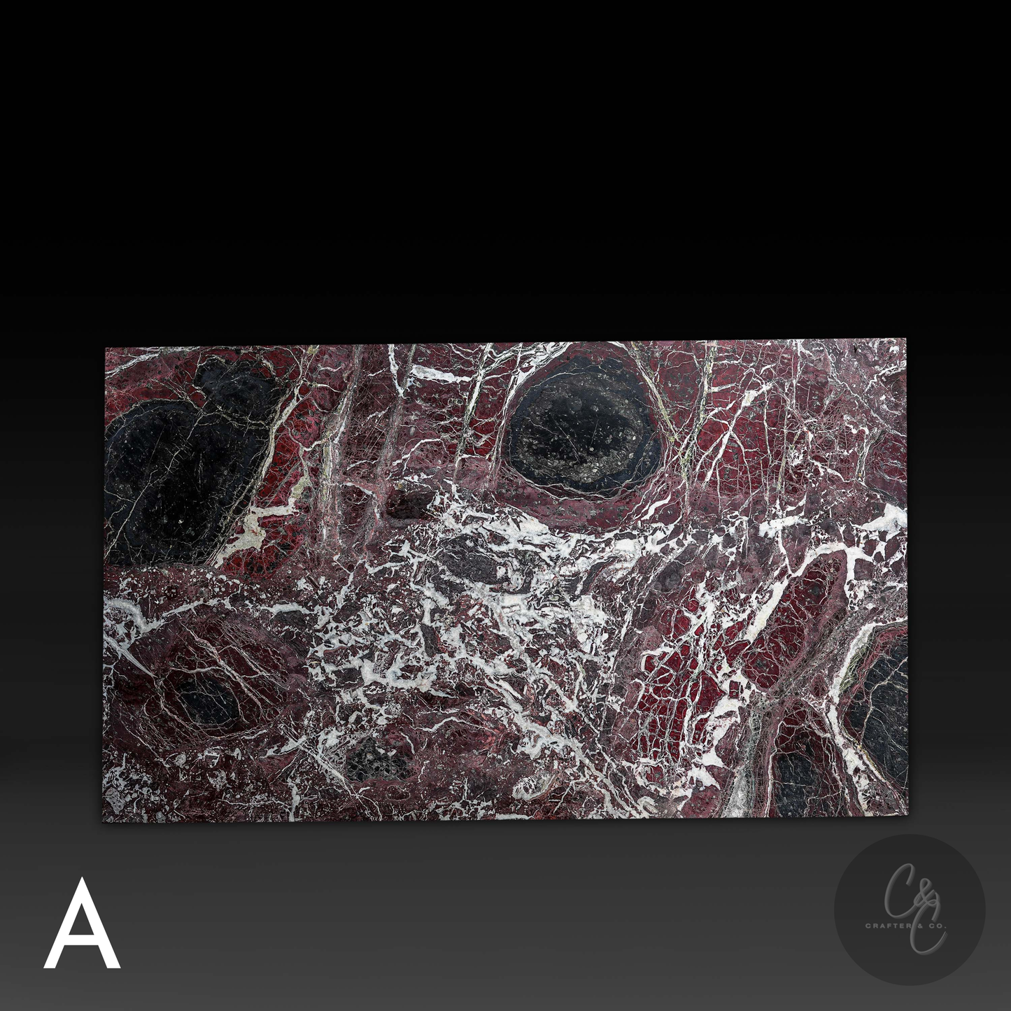 Close-up of Rosso Levanto marble top surface showing rich burgundy tones, black accents and natural white veining