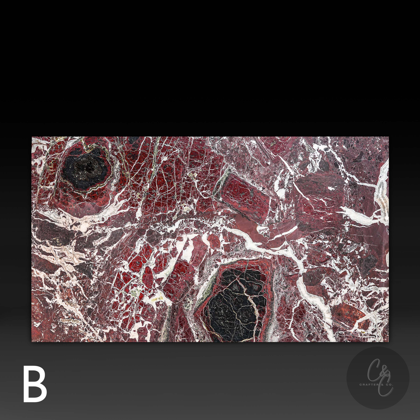 Close-up of Rosso Levanto marble top surface on Small Block Coffee Table Variant B featuring rich burgundy tones, black accents and natural white veining