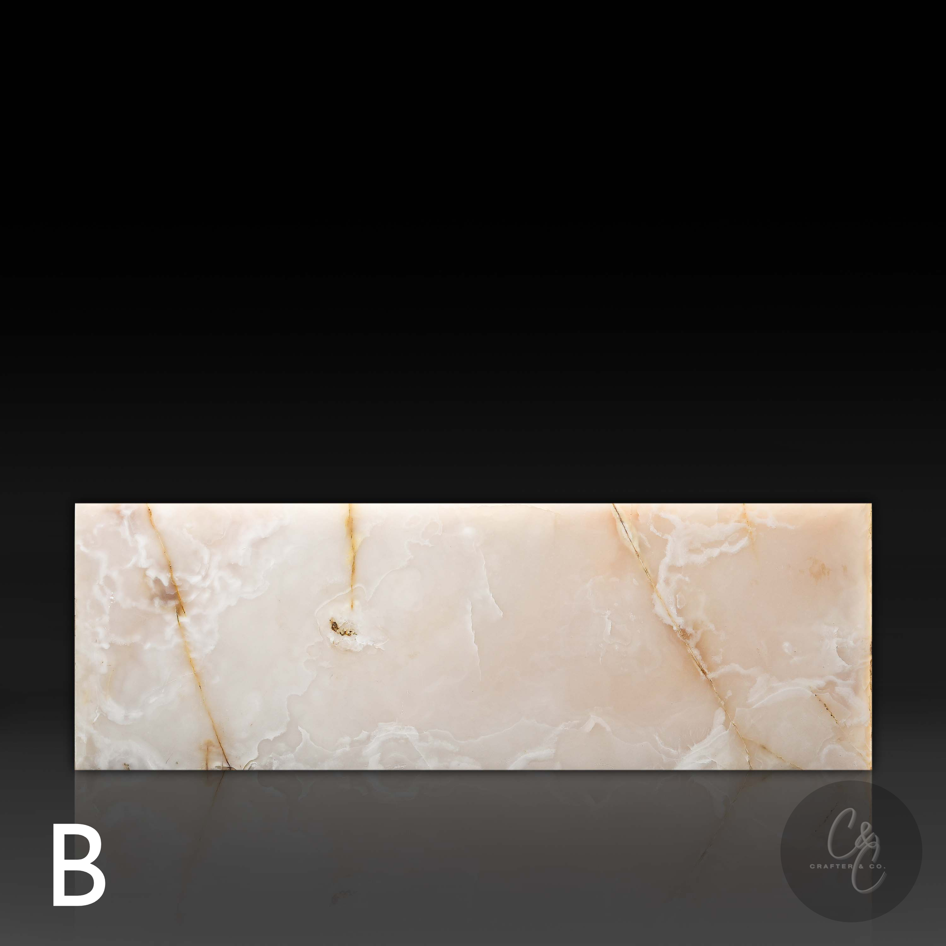 Front profile of Small Block White Onyx Coffee Table Variant B featuring polished natural white onyx with warm ivory tones and golden veining