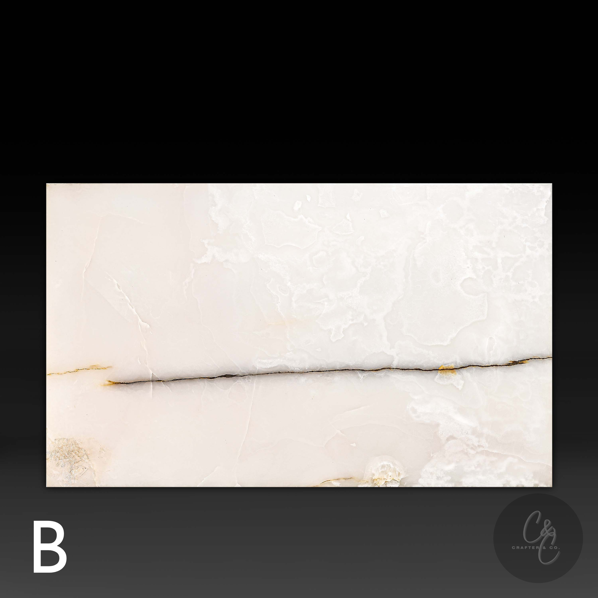 Top view of Small Block White Onyx Coffee Table Variant B showcasing polished natural white onyx with ivory, gold and honey veining